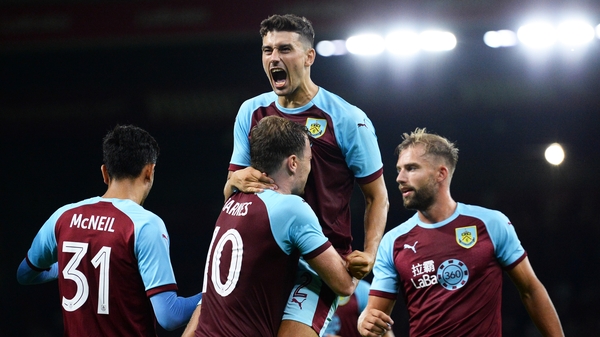 Burnley players celebrate a goal against Aberdeen.