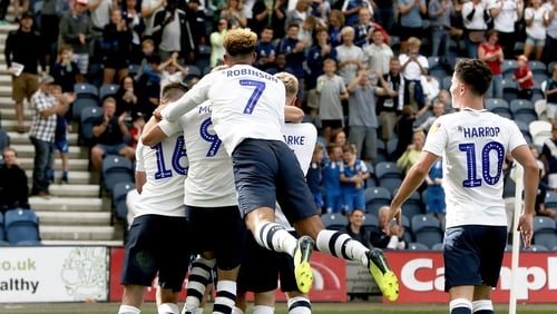 Alan Browne is mobbed by his teammates after giving his side the lead
