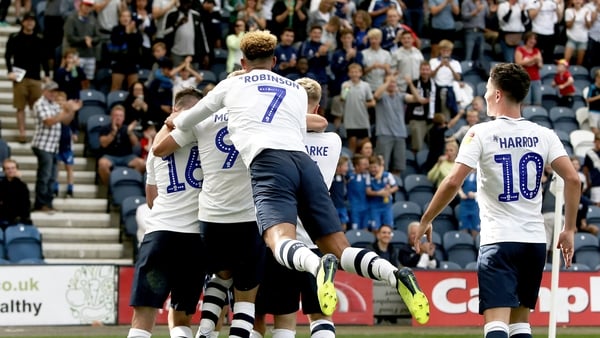 Alan Browne is mobbed by his teammates after giving his side the lead