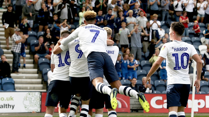 Alan Browne is mobbed by his teammates after giving his side the lead