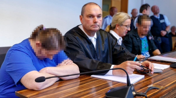The couple (faces pixelated on court orders) are seen with their lawyers