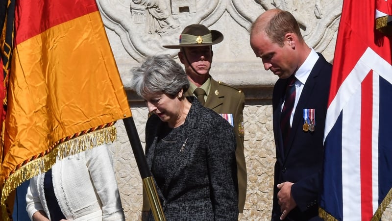Britain's Prime Minister Theresa May and Prince William leave the cathedral in Amiens after attending the ceremony