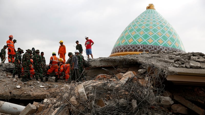 Hundreds of buildings were flattened and the death toll could rise as authorities search the rubble
