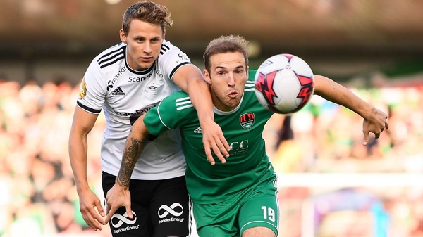 Karl Sheppard of Cork City holds off Vegar Hedenstad
