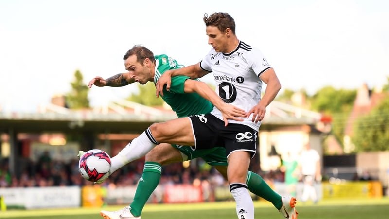 Karl Sheppard of Cork City in action against Vegar Hedenstad of Rosenborg