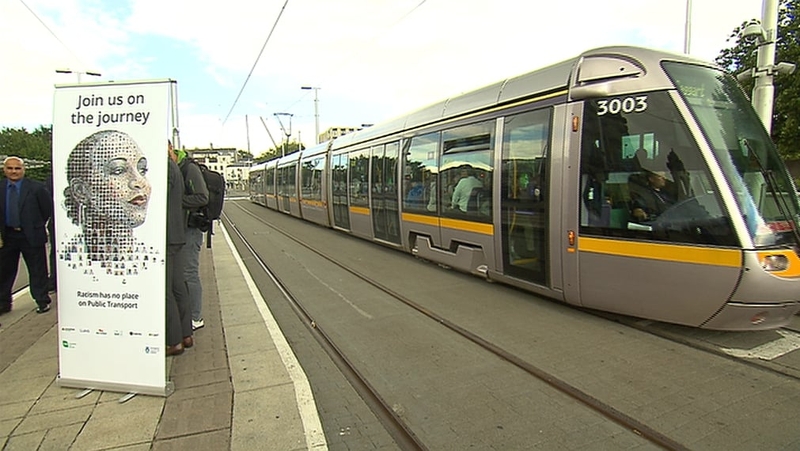 The poster features a montage of 792 selfies from commuters made into an image of a face