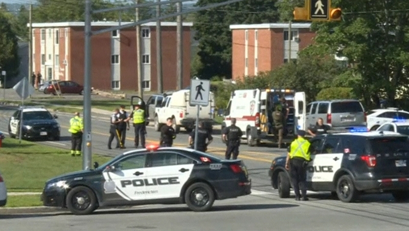 Local media images showed emergency vehicles converging on a tree-lined residential street
