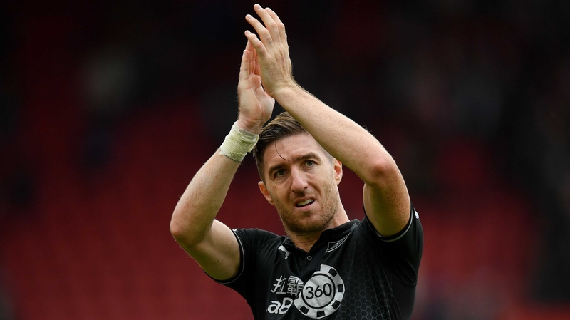 Stephen Ward salutes the Burnley fans