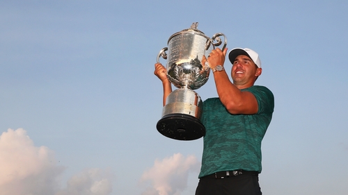 Brooks Koepka lifts the trophy
