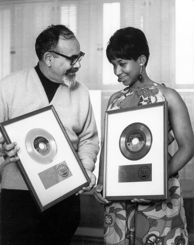 Singer Aretha Franklin and producer Jerry Wexler receive their gold records for their hit single 'I Never Loved A Man (The Way I Love You) in 1967 in New York city, New York. (Photo by Michael Ochs Archives/Getty Images)