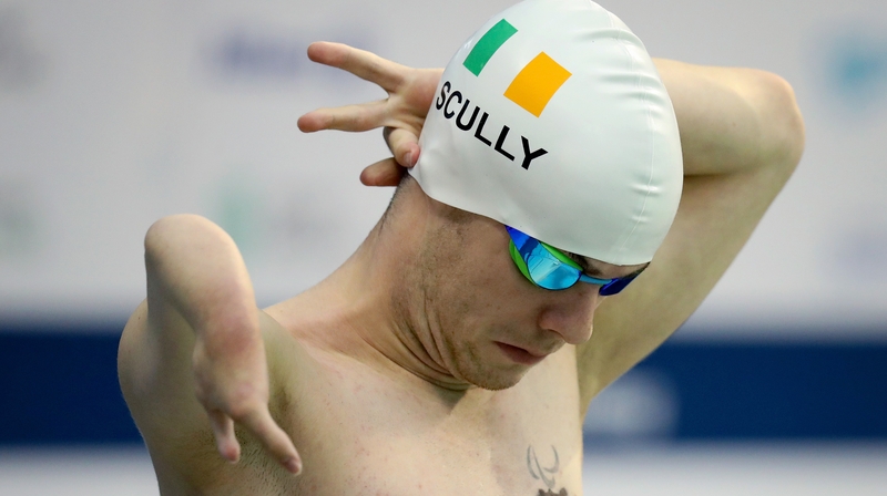 Scully gets ready to swim in his final
