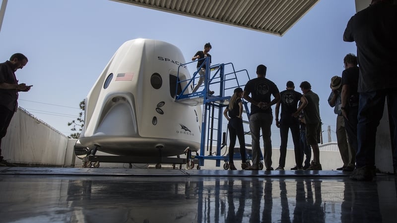 A mock up of the Crew Dragon spacecraft during a media tour of SpaceX headquarters and rocket factory