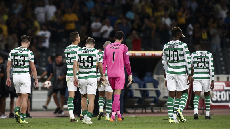 Celtic players trudge off after the defeat
