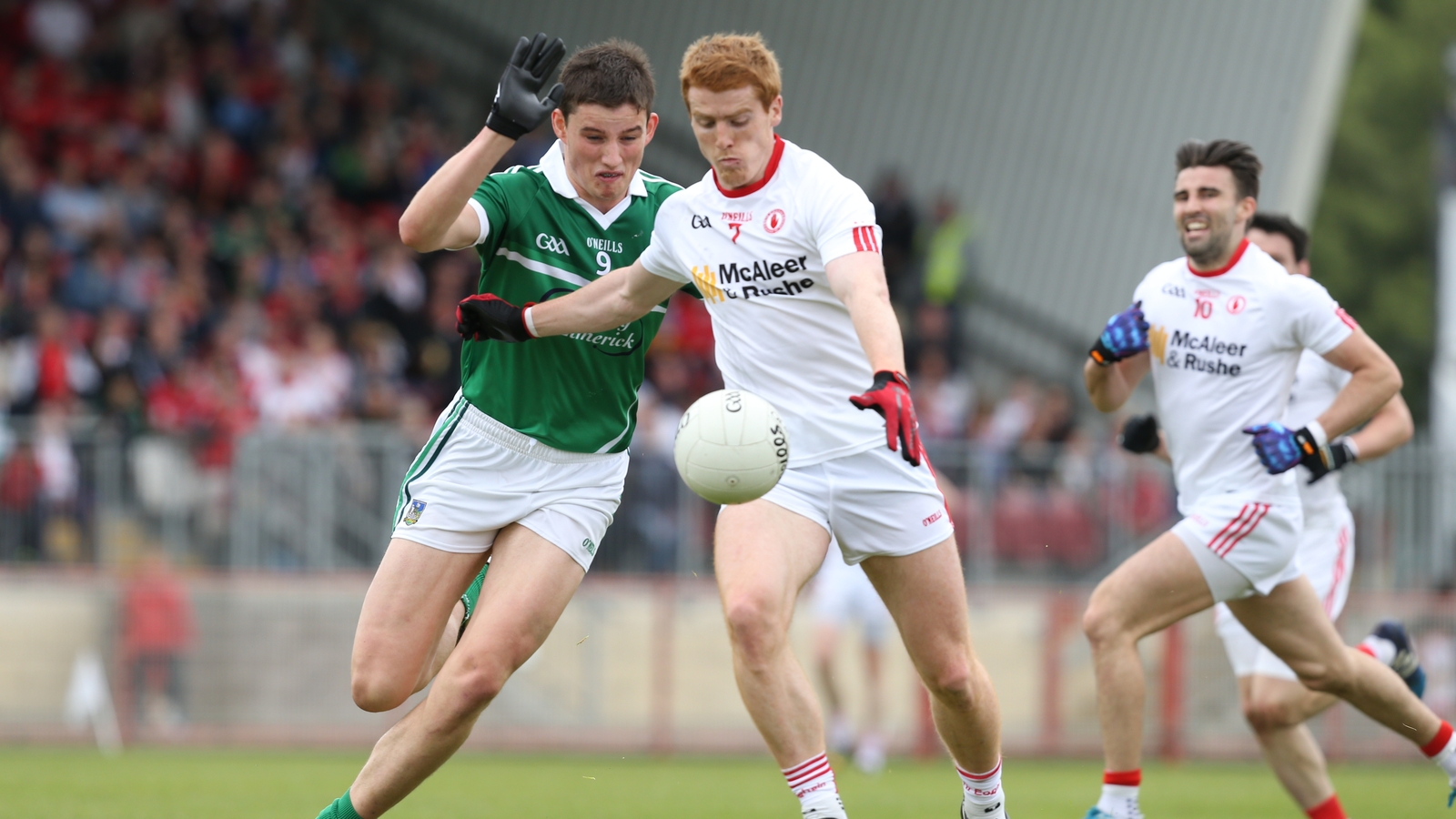 Gearoid Hegarty attempts to tackle Tyrone's Peter Harte in the 2015 All-Ireland football qualifier