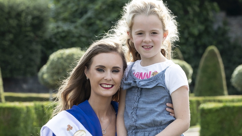 9-year-old Nia Walshe from Castleknock, who's grandmother is from Kerry, poses with the Kerry Rose Celine O'Shea at the RTÉ Rose of Tralee launch