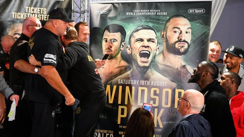 John Fury, left, father of Tyson Fury, exchanges words with WBC Heavyweight champion Deontay Wilder