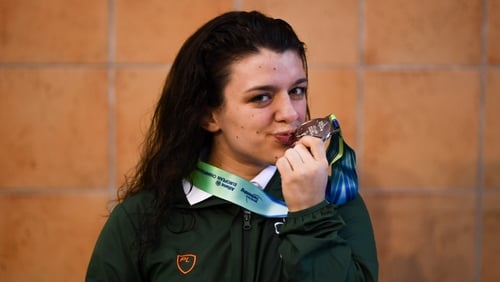 Turner celebrates after the medal ceremony