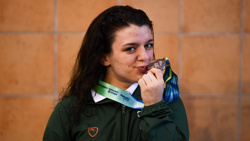 Turner celebrates after the medal ceremony