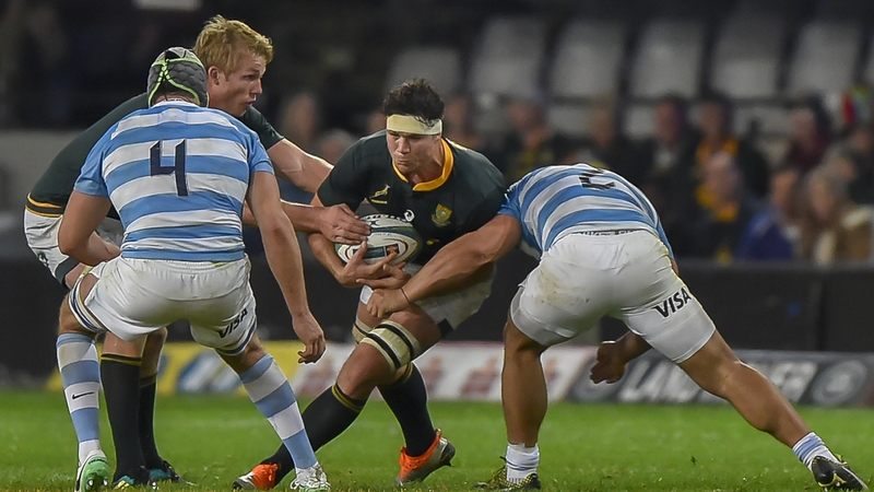 South Africa's flanker Francois Louw is tackled by Argentina's hooker and captain Agustin Creevy