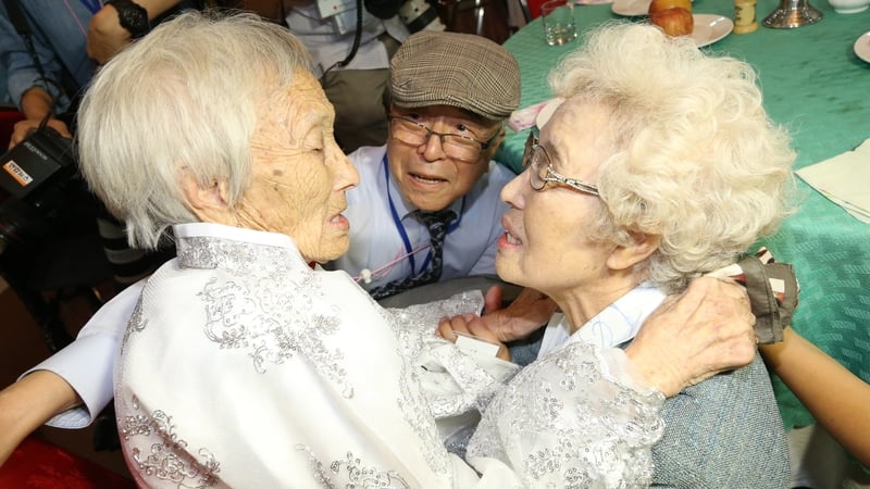 Cho Sun-do (L), 89, meets her younger sister Cho Hye-do (R), 86, and younger brother Cho Do-jae (C), 75, during the inter-Korean family reunions