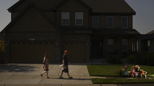 Neighbours of Shanann, Bella and Celeste Watts leave tributes outside the family home in Fredrick, Colorado