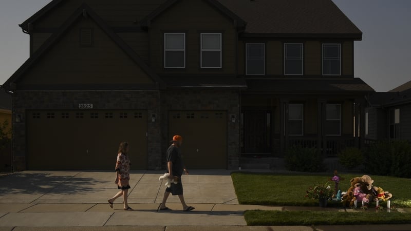 Neighbours of Shanann, Bella and Celeste Watts leave tributes outside the family home in Fredrick, Colorado