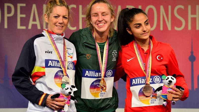 Greta Streimikyte (C) with her gold medal in Berlin