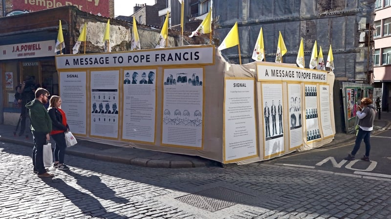 Nine wooden panels with art and graphics detailing the stages of harm endured from child sexual abuse have been erected
