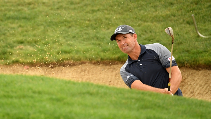 Pádraig Harrington chips out of a bunker on the 17th
