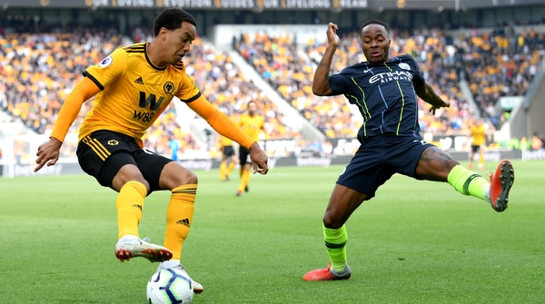 Helder Costa of Wolverhampton Wanderers is put under from Raheem Sterling of Manchester City