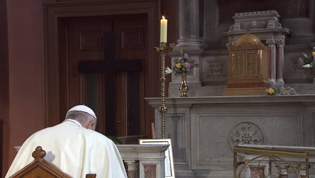 The Pope prays in silence at the Candle of Innocence for survivors of abuse