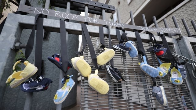 Pairs of baby shoes hang from the railings on Sean McDermott Street in Dublin in memory of the children who died at the Bon Secours Mother and Baby Home in Tuam, Co Galway