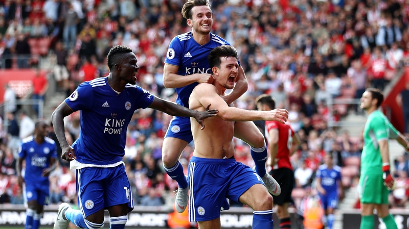 Harry Maguire (no shirt) celebrates scoring the winner
