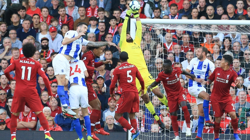 Liverpool's Brazilian goalkeeper Alisson Becker makes a save