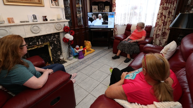 The Dalton and Hutchins in Dublin watch Pope Francis on RTÉ News Now