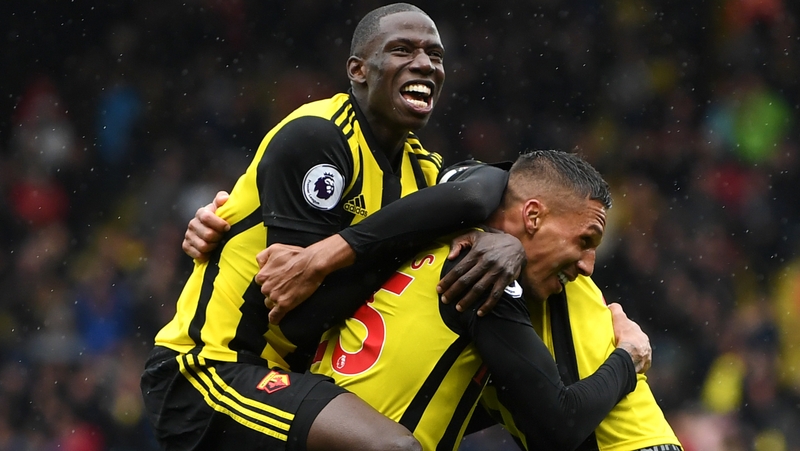 Jose Holebas of Watford is mobbed by team-mates after scoring the winner