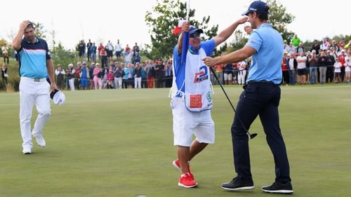 Andrea Pavan celebrates his victory as Padraig Harrington looks on