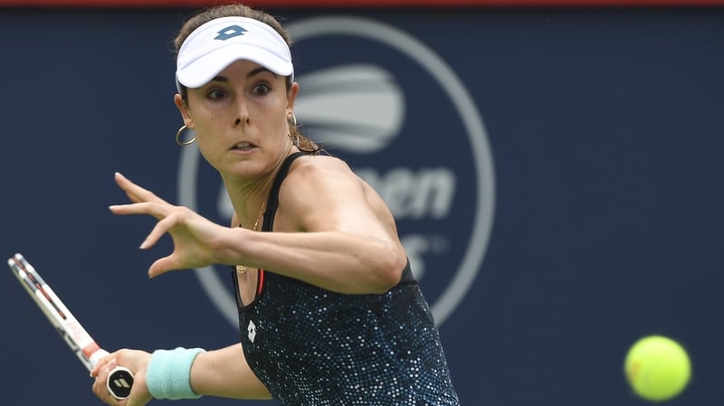 Alize Cornet received a warning for changing her top on court at Flushing Meadows