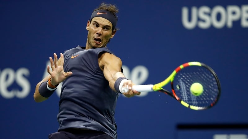 Rafael Nadal hits a shot against Vasek Pospisil