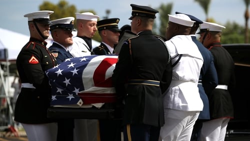 Military pallbearers carry the casket of John McCain in to a memorial service at the North Phoenix Baptist Church