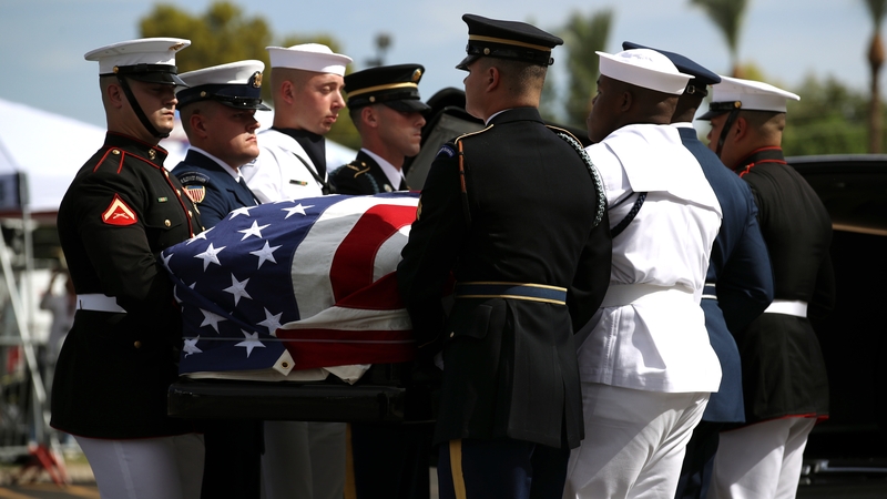 Military pallbearers carry the casket of John McCain in to a memorial service at the North Phoenix Baptist Church