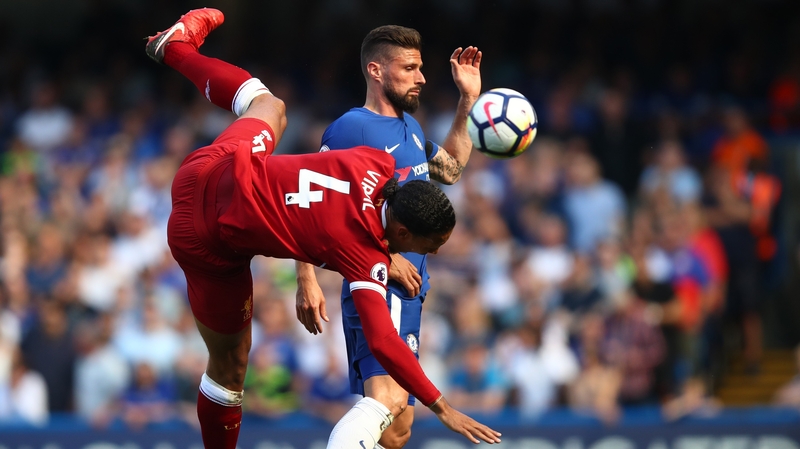 Virgil van Dijk tangles with Olivier Giroud