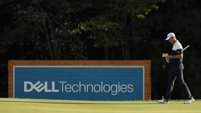 Rose checking his yardage book in Massachusetts