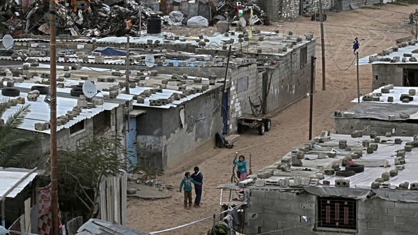 Palestinian refugee children play outside in Khan Younis refugee camp in southern Gaza