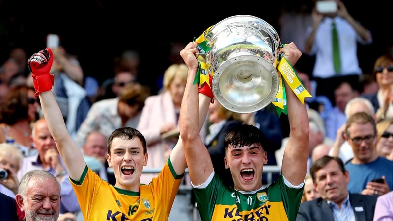 Kerry goalkeeper Marc Kelliher and Paul O'Shea lift the Tom Markham Cup.