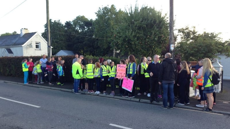 Students and their parents walked with placards to their school in Trim
