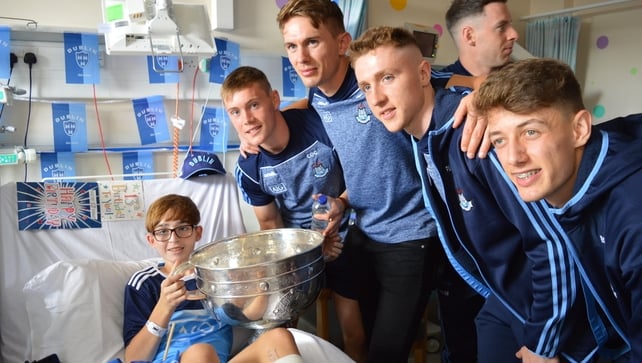 Pictured with the Sam Maguire Cup and Dublin team is Tadhg Holder