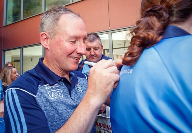Jim Gavin signs a jersey