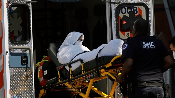 A passenger who took ill on the flight is taken to hospital in New York