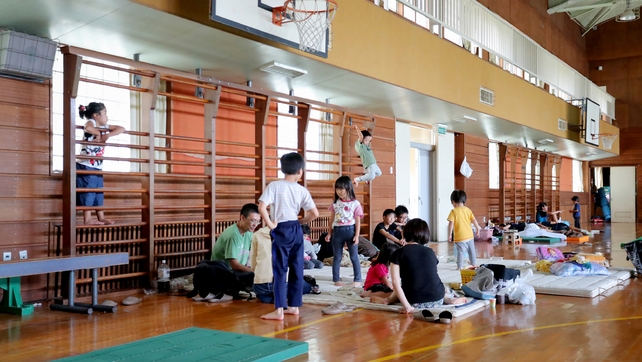 Residents from an earthquake-hit area take shelter at an elementary school in Abira town